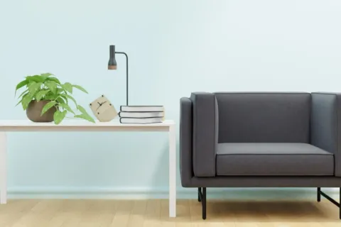 Penataan ruang tamu rapi dengan furnitur minimalis berkaki ramping dan meja multifungsi